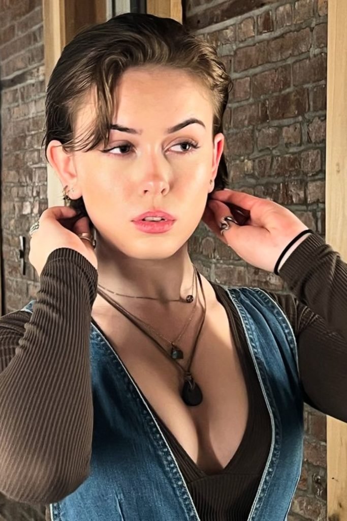 1. Slicked-Back Natural Pixie Haircut