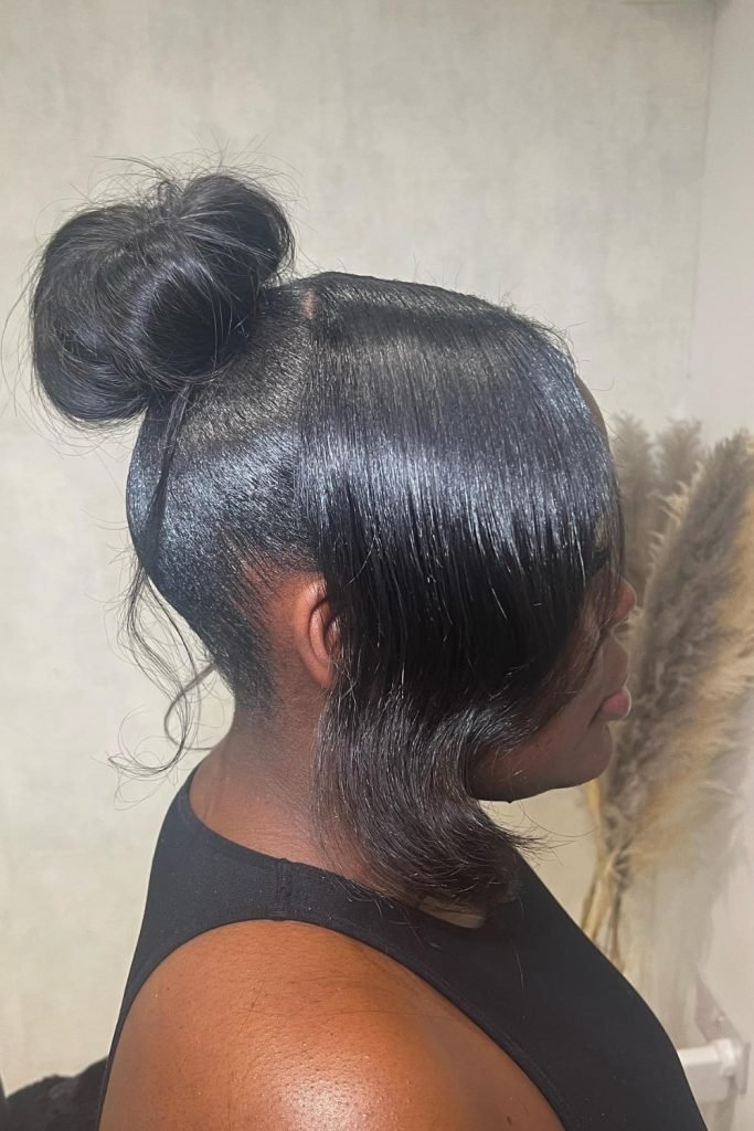 11. Bun with Side Bangs - Elegant and Stylish