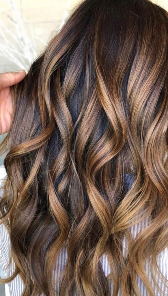 11. Caramel Swirl Butterfly Cut Hairstyle