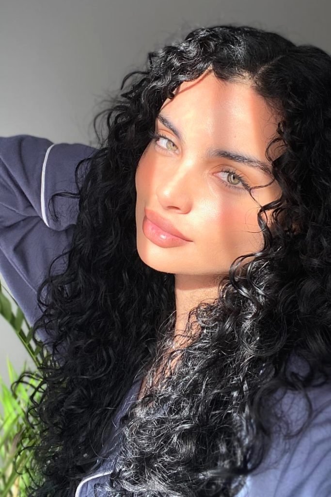 Luxurious Black Curls with Subtle Layers