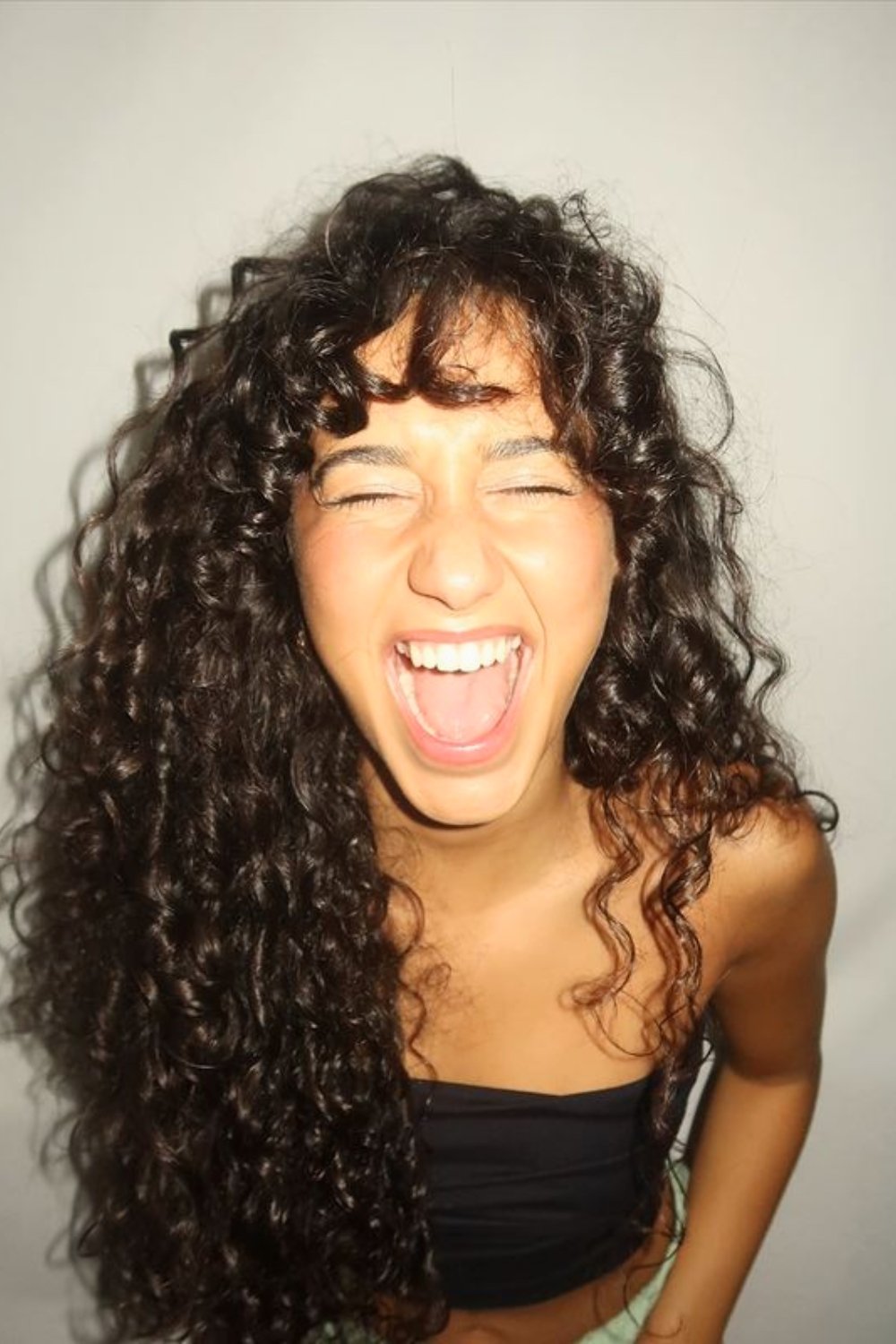 Playful French Curls with Bangs
