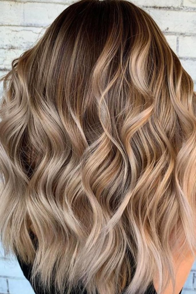 Sandy Blonde Waves with Dark Roots