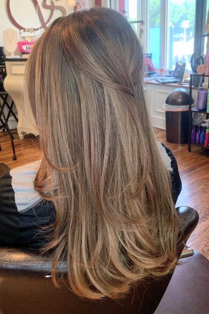 Sleek Half-Up Twist with Layered Lengths