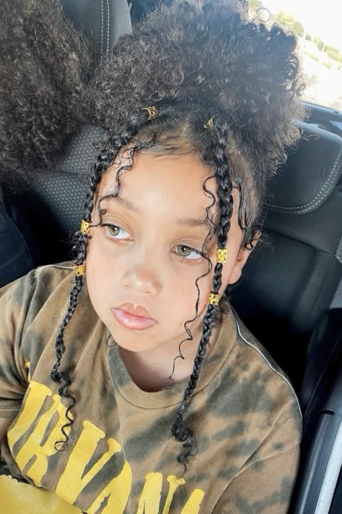 16. Whimsical Curly Pigtails with Golden Beads