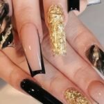 17. Black and Gold Coffin Nails