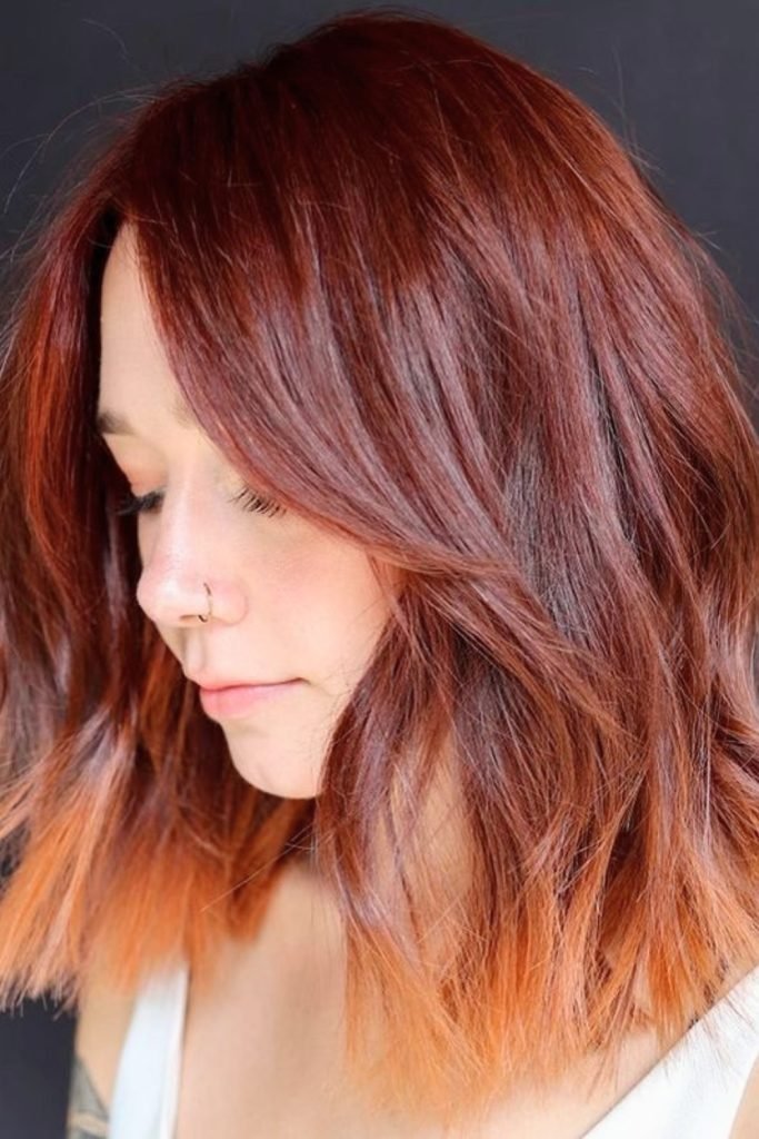 17. Fiery Copper with Peach Tips: Fall-Inspired Hair Color