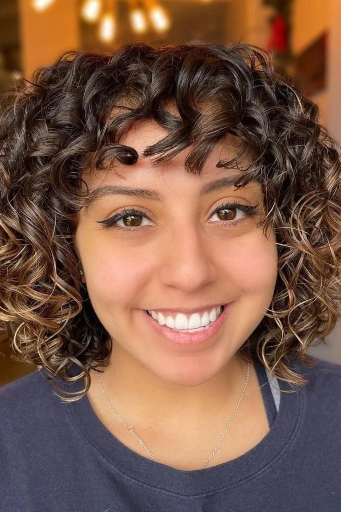 Short Permed Hair with Caramel Highlights