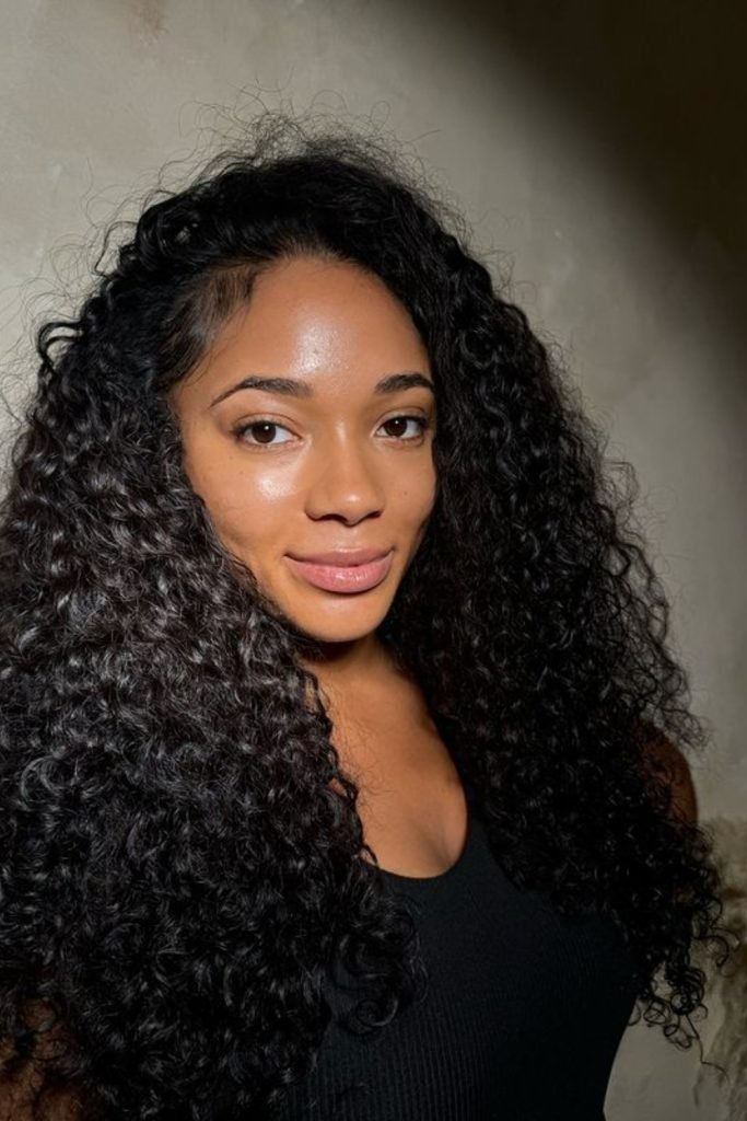 18. Deep Side Part with Voluminous Curls