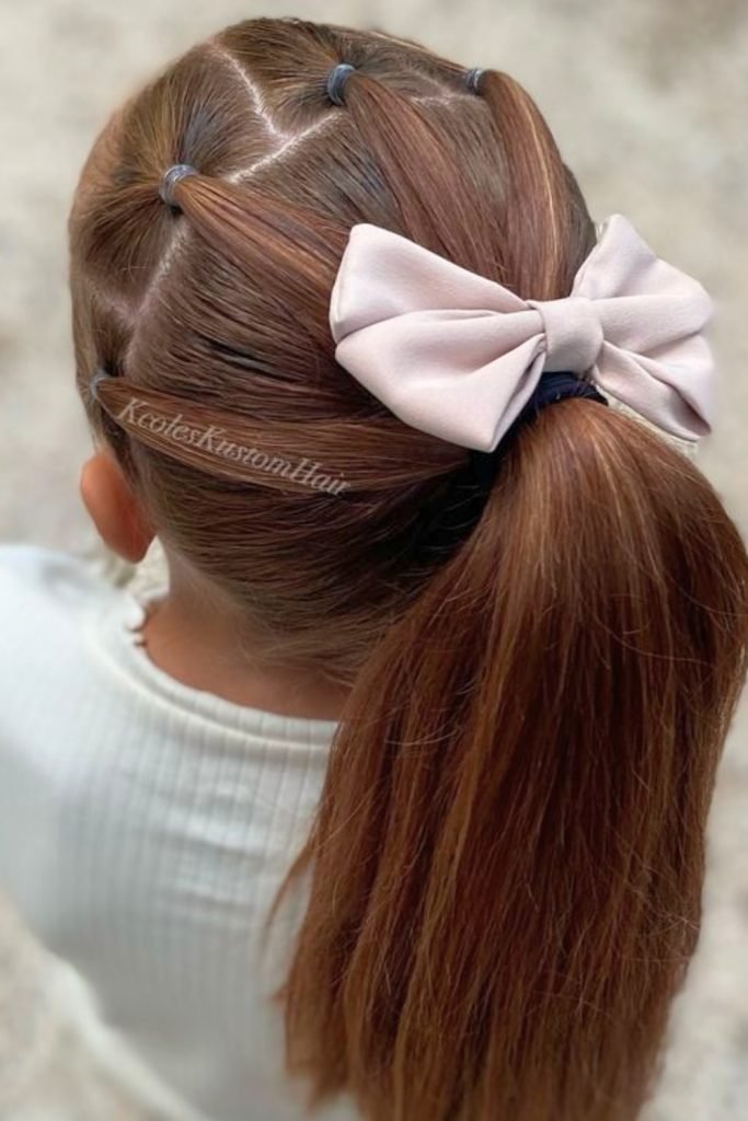 Puffed Ponytail with Bow Accent