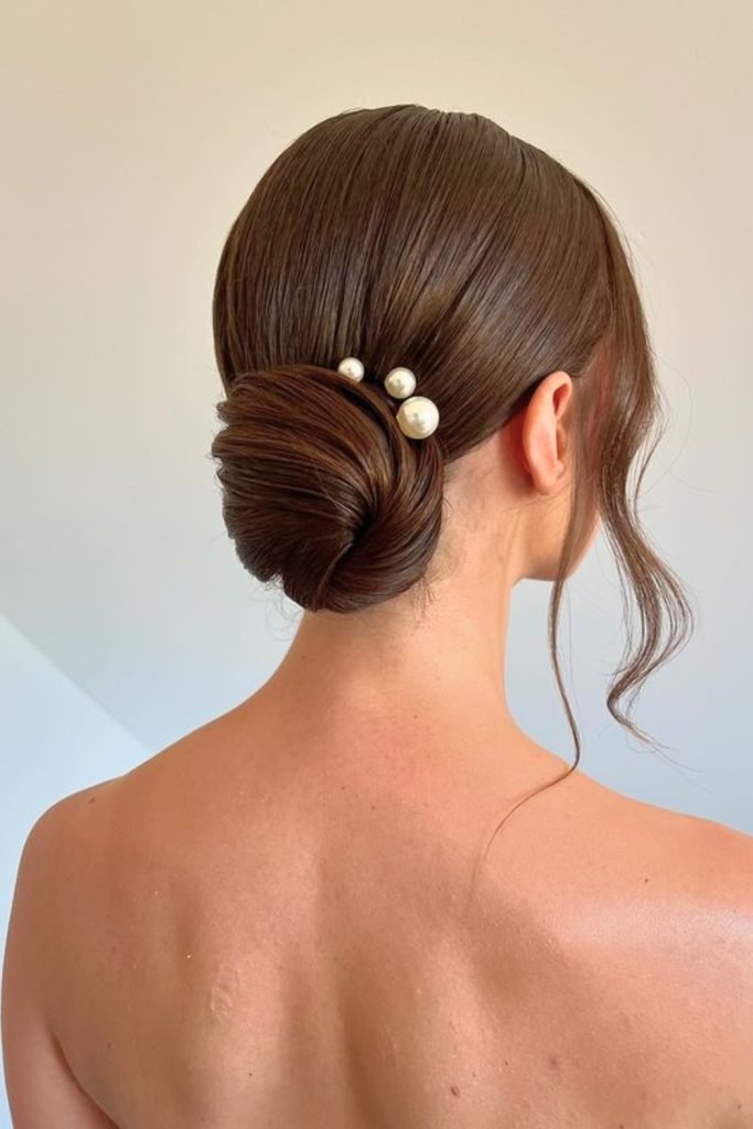 Sleek Low Bun with Pearl Accents