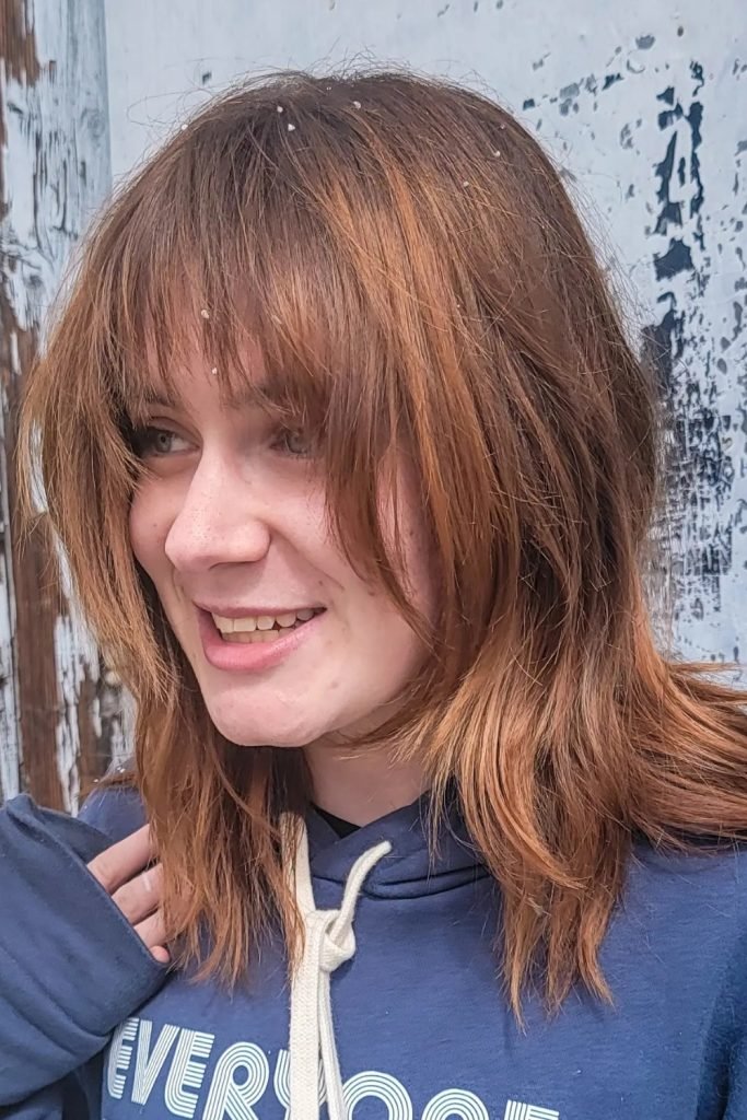 Curtain Bangs with a Vibrant Shag Hairstyle