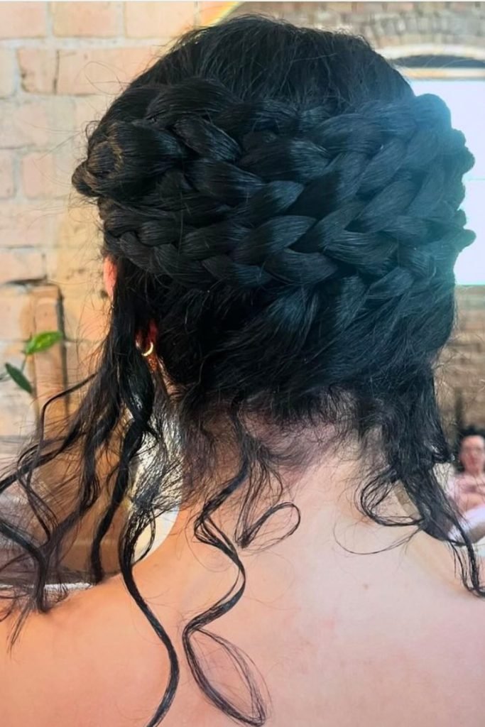 28. Elegant Crown Braid Hairstyle with Romantic Tendrils