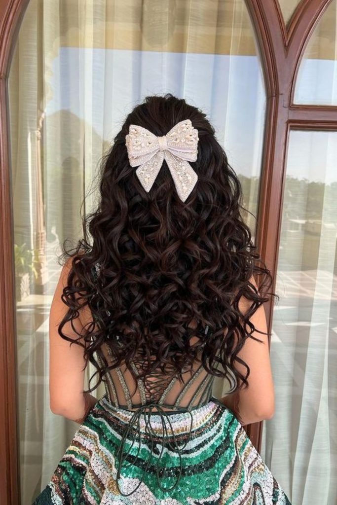3. Glittering Bow on Voluminous Curls