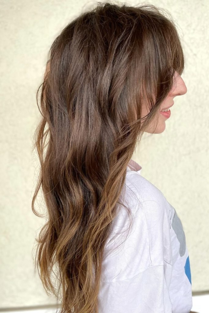 30. Curtain Bangs with Tousled Hair