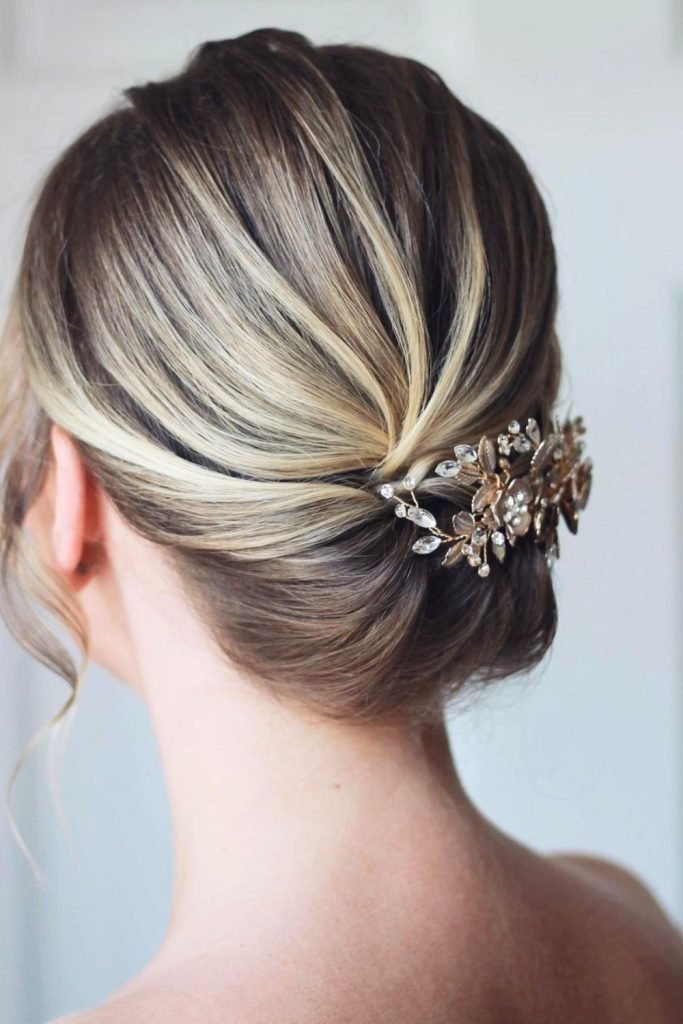 Elegant Tucked Chignon with Crystal Adornments