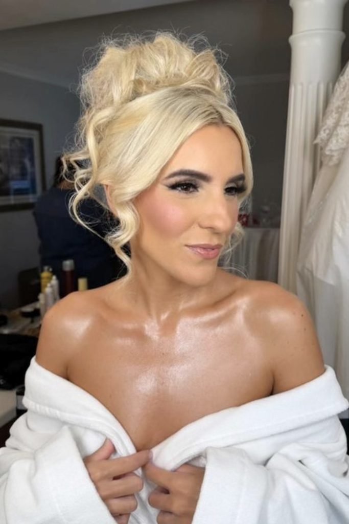 Voluminous Updo with Soft Curls for Brides