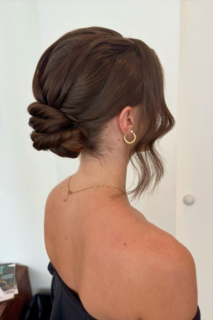 Twisted Low Bun with Face-Framing Layers