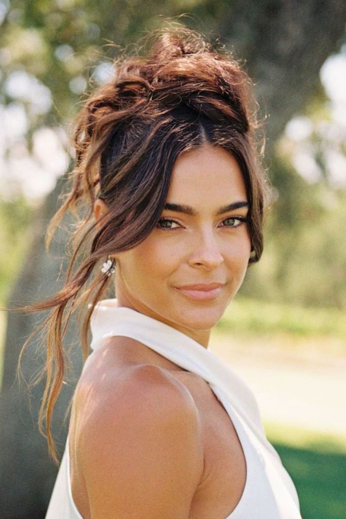 Elegant Birthday Bun with Face-Framing Tendrils Hairstyle