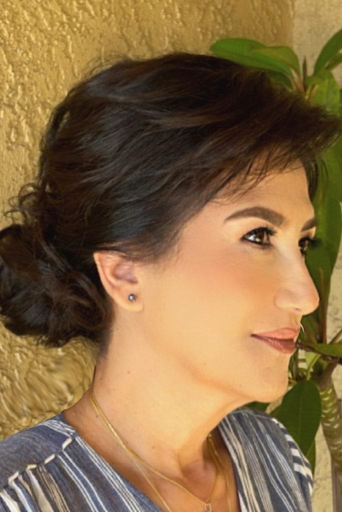 5. Tousled Low Bun Hairstyle