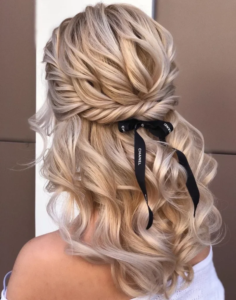 Effortlessly Glam: Half-Up Bow Twist Hairstyle