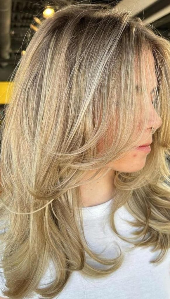 Honey-Blonde Butterfly Cut with Loose Curls