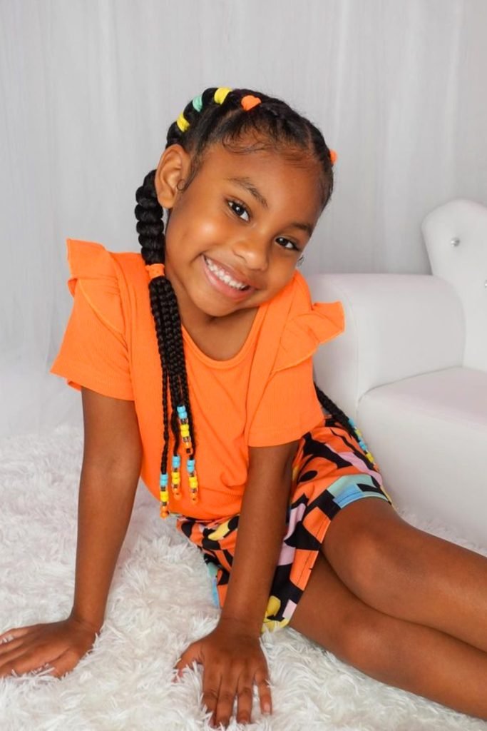 9. Playful Beaded Pigtails Hairstyle for Toddlers